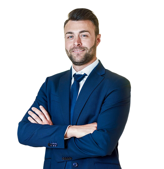 Azure Consulting Services 11 Man in blue suit posing over white artistic wall from bricks. 2